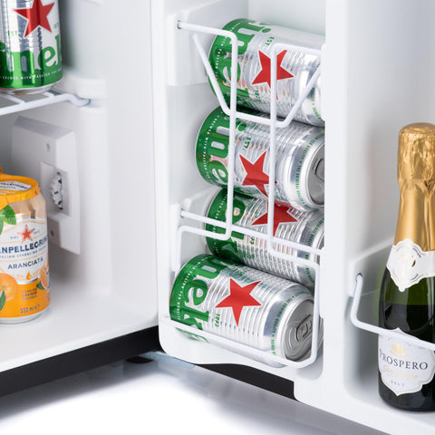 White wire can rack holding stacked heineken cans inside a subcold eco75 table top fridge