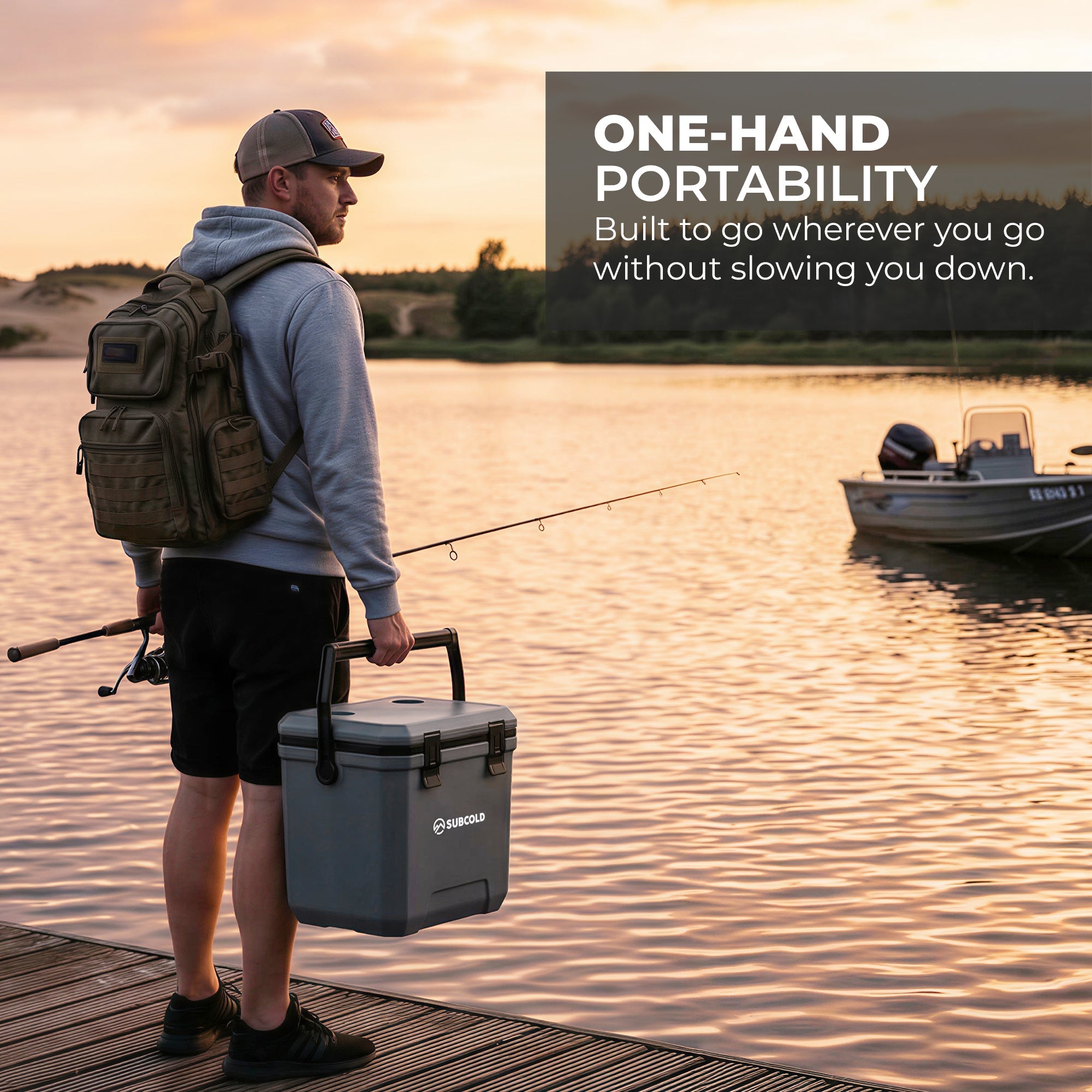 Gray insulated cool box with black handles and latches featuring suncold logo subcold master24 cool box