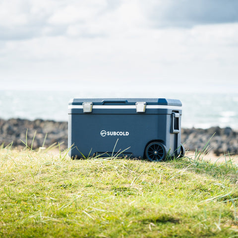 Dark blue mobi70 cool box with silver latches and black wheels ideal for portable cooling and storage