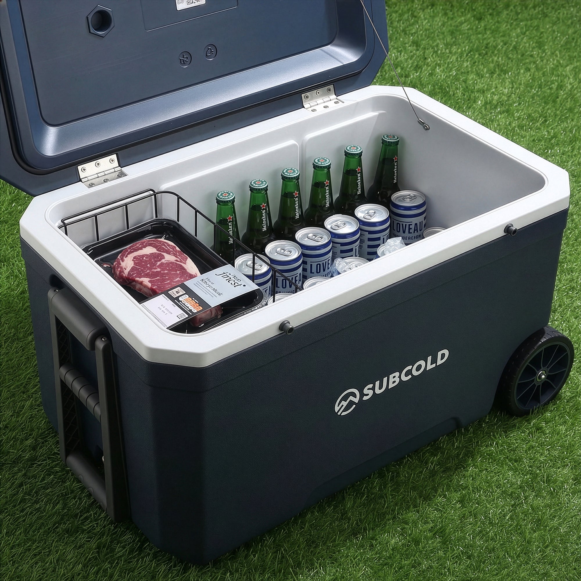 Dark blue and white subcold mobi70 cool box with wheels and wire rack holding drinks and packaged steak