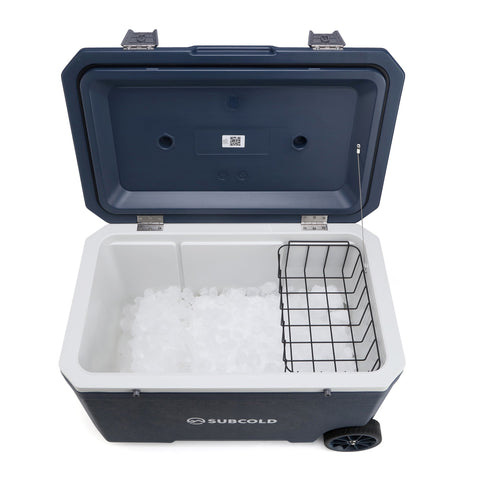 Navy blue subcold mobi70 cool box with white interior black wire basket insert and wheels for easy storage and transport