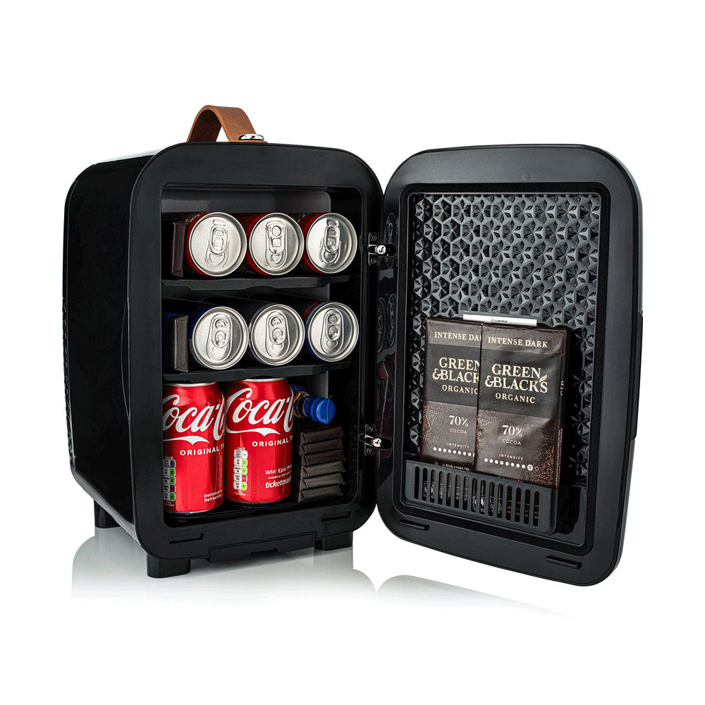 Black subcold pro 10l mini fridge with brown leather handle and shelves storing soda cans and chocolate bars