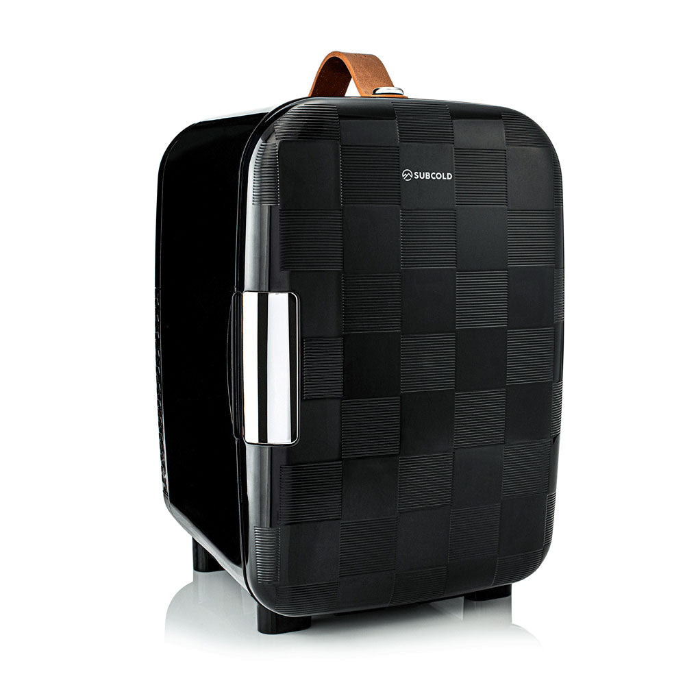 Black subcold pro 10l mini fridge with textured checkered pattern chrome handle and brown leather top carry strap
