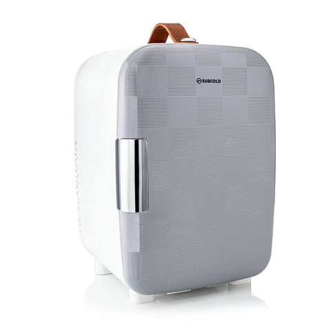 Subcold pro 10l mini fridge in gray and white with checkered texture silver handle and brown leather carry strap mini fridge