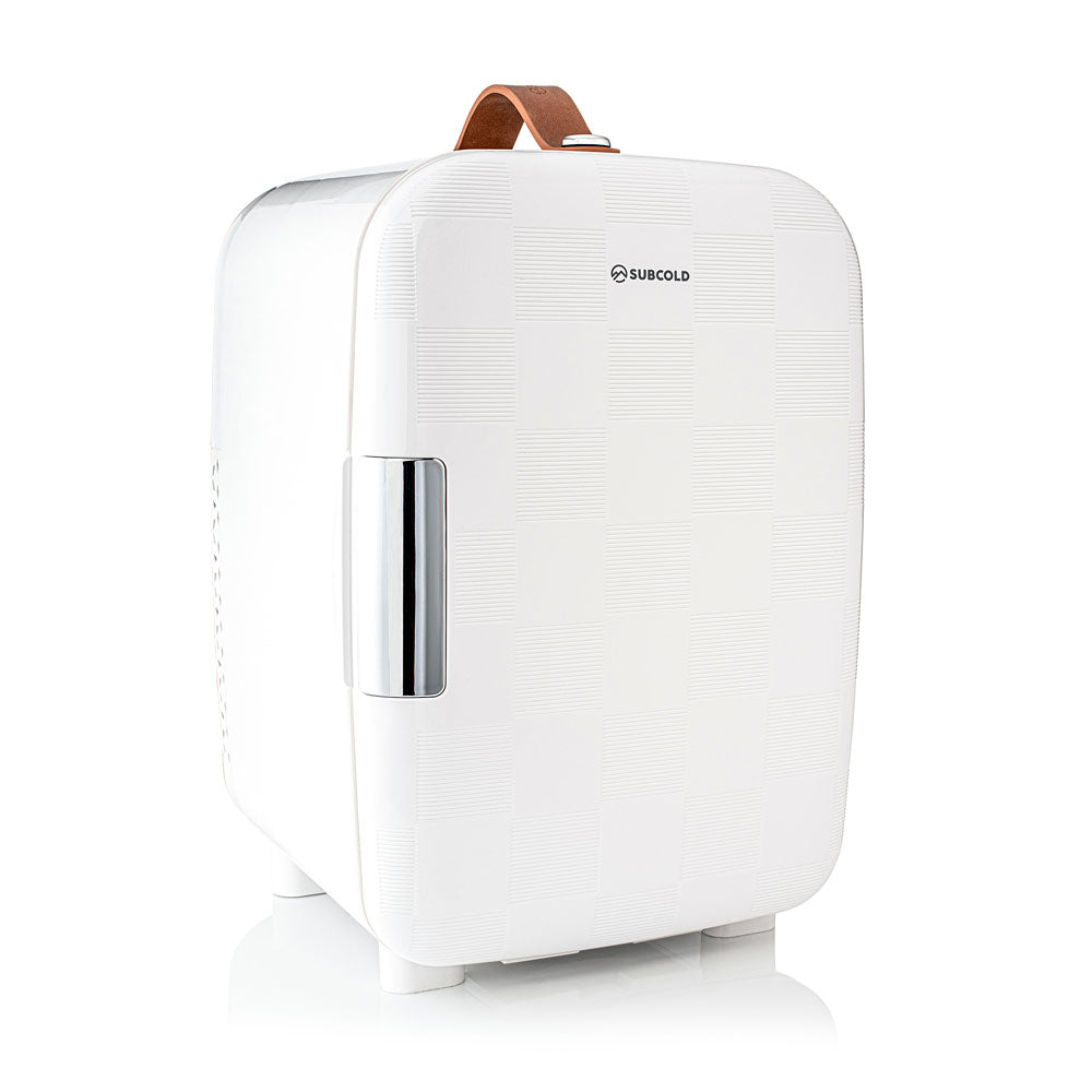 White subcold pro 10l mini fridge with textured surface silver handle and brown leather carry strap compact 10l mini fridge