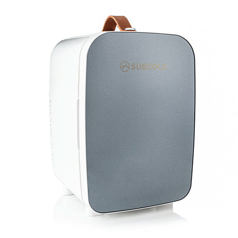 Subcold Pro 10l mini fridge in gray and white with a brown leather handle portable 10l mini fridge