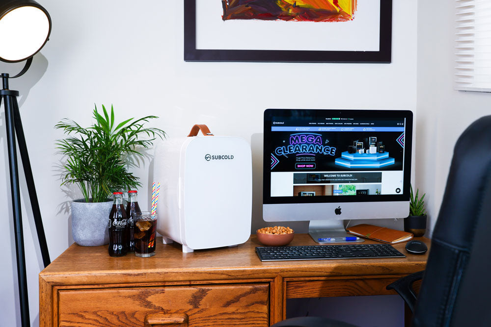 White subcold pro 10l mini fridge with a sleek modern design and brown handle perfect for small spaces
