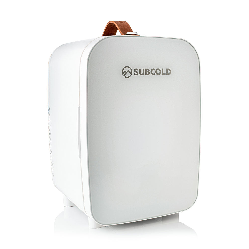 White subcold pro 10l mini fridge with brown leather handle and sleek rounded design perfect for small spaces