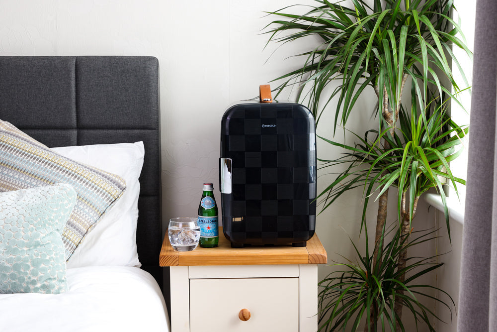 Black checkered subcold pro 15l mini fridge with tan leather handle and silver hinge perfect for small spaces