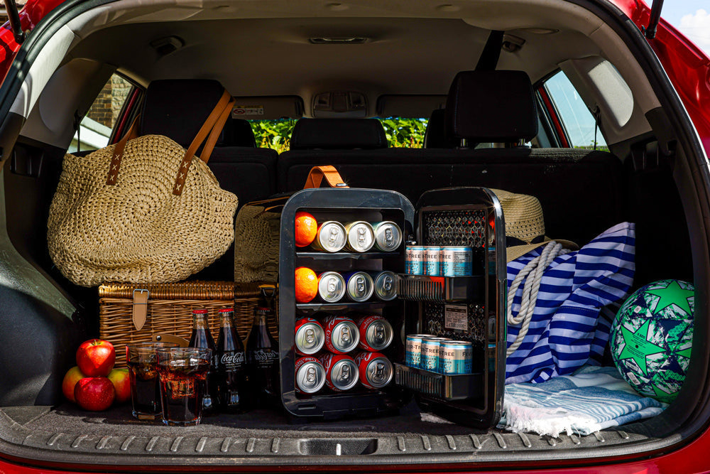 Black subcold pro 15l mini fridge with glass doors and multiple shelves holding canned drinks in a compact mini fridge