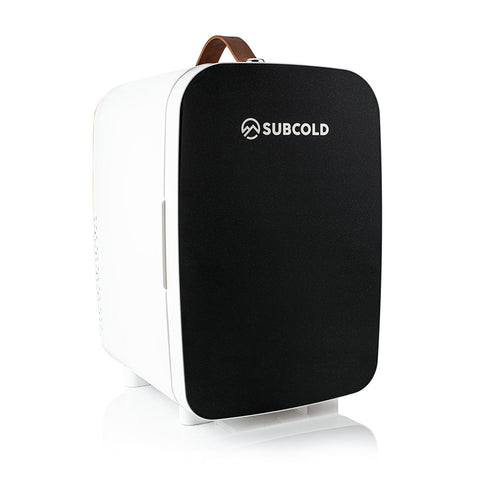 Black and white subcold pro 15l mini fridge with a brown leather handle perfect for small spaces