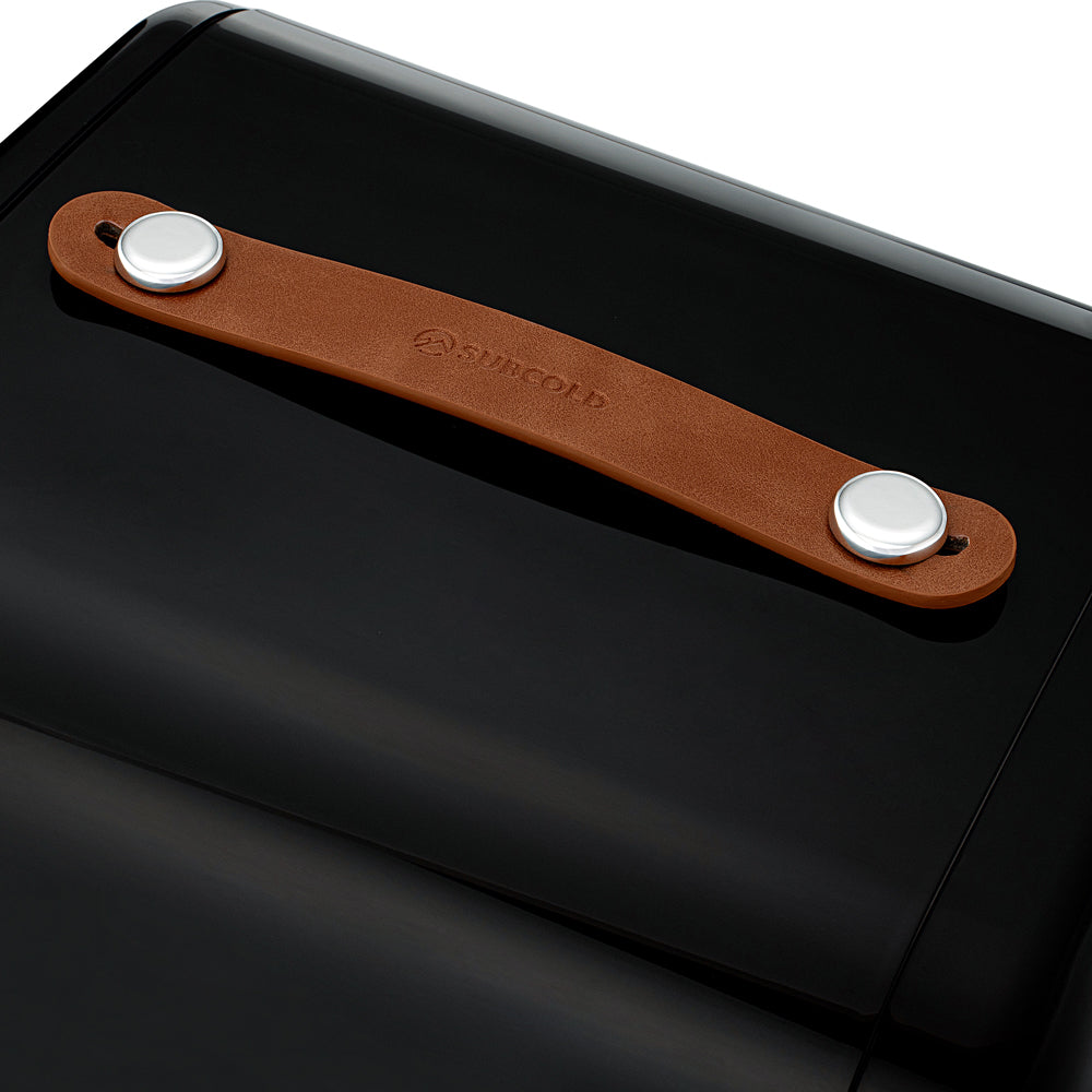 Brown leather strap with silver clasps and suncold branding on the back of a subcold pro 15l mini fridge