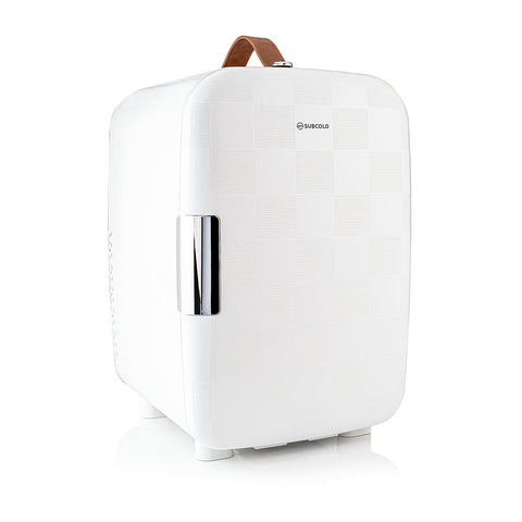 White subcold pro 15l mini fridge with textured surface chrome handle and brown leather carry strap compact 15l mini fridge
