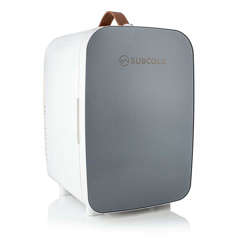 Gray and white subcold pro 15l mini fridge with a brown leather handle portable 15l mini fridge perfect for travel
