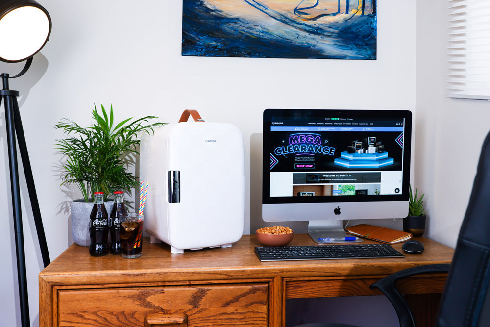 White subcold pro 15l mini fridge with brown leather handle and black vertical grip compact and stylish 15l mini fridge