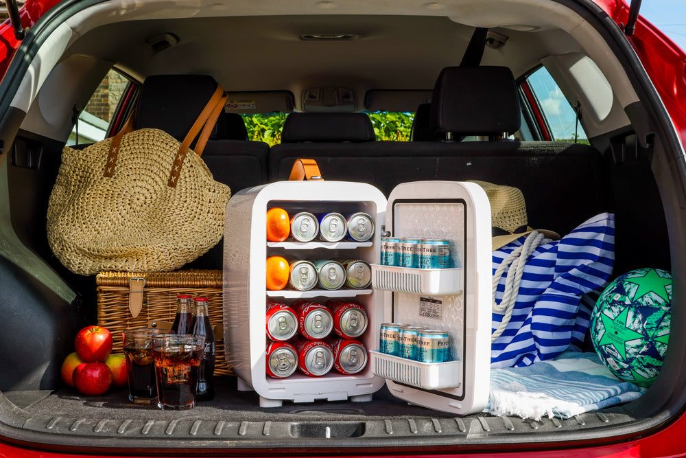 White compact pro 15l mini fridge with open doors showing shelves stocked with soda cans and oranges