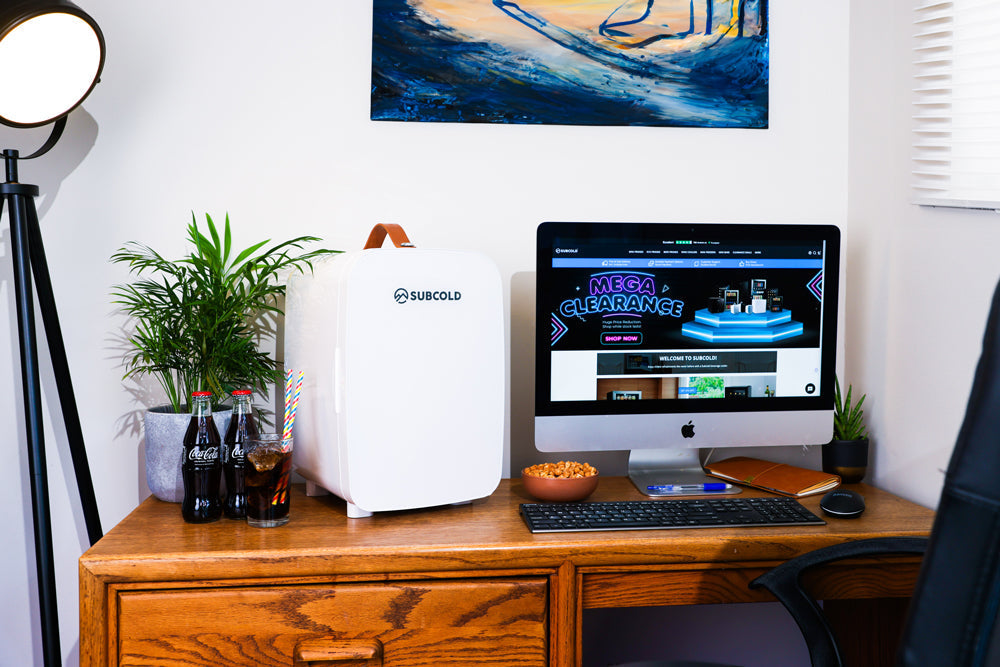 White subcold pro 15l mini fridge with a brown leather handle compact 15l mini fridge for small spaces