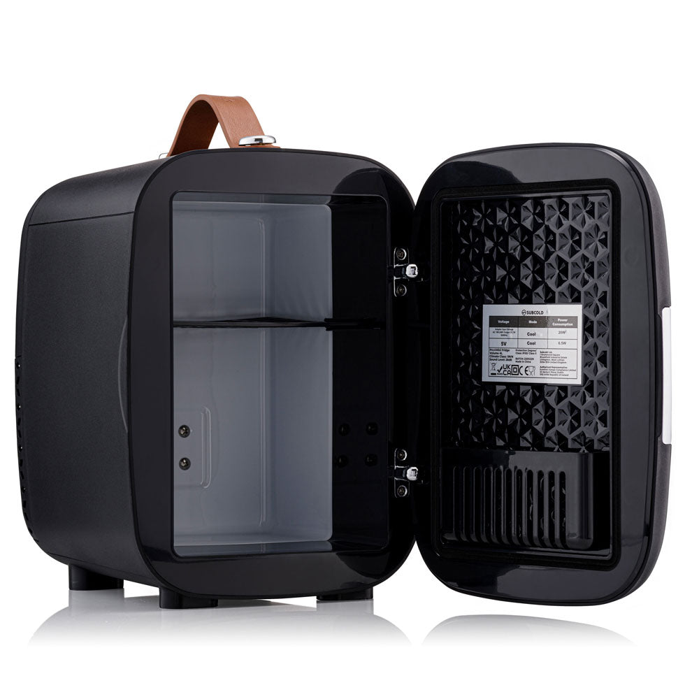 Black Subcold pro 4l mini fridge with brown leather handle and interior shelving for compact cooling needs