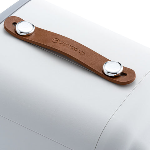 Brown leather handle with silver metal caps and subcold logo on pro 4l mini fridge for easy portability
