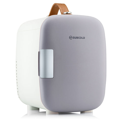 Gray and white subcold pro 4l mini fridge with tan leather handle compact and stylish mini fridge for small spaces