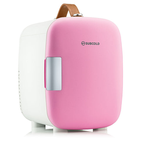 Subcold pro 4l mini fridge in pink and white with a tan leather handle for easy portable use