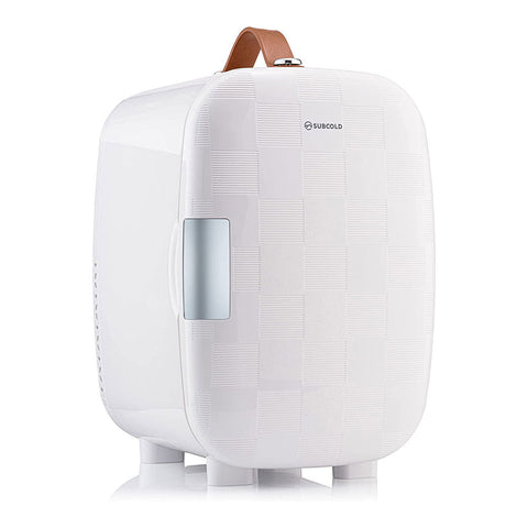 Subcold pro 6l mini fridge with a white textured surface brown leather handle silver door panel and removable shelf for larger items