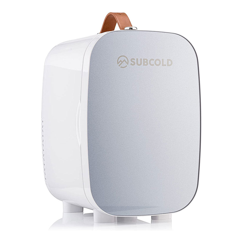 White and silver subcold pro 6l mini fridge with brown leather handle and removable shelf for larger items