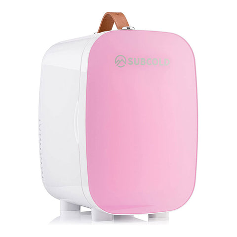Pink and white subcold pro 6l mini fridge with brown leather handle and removable shelf for larger items