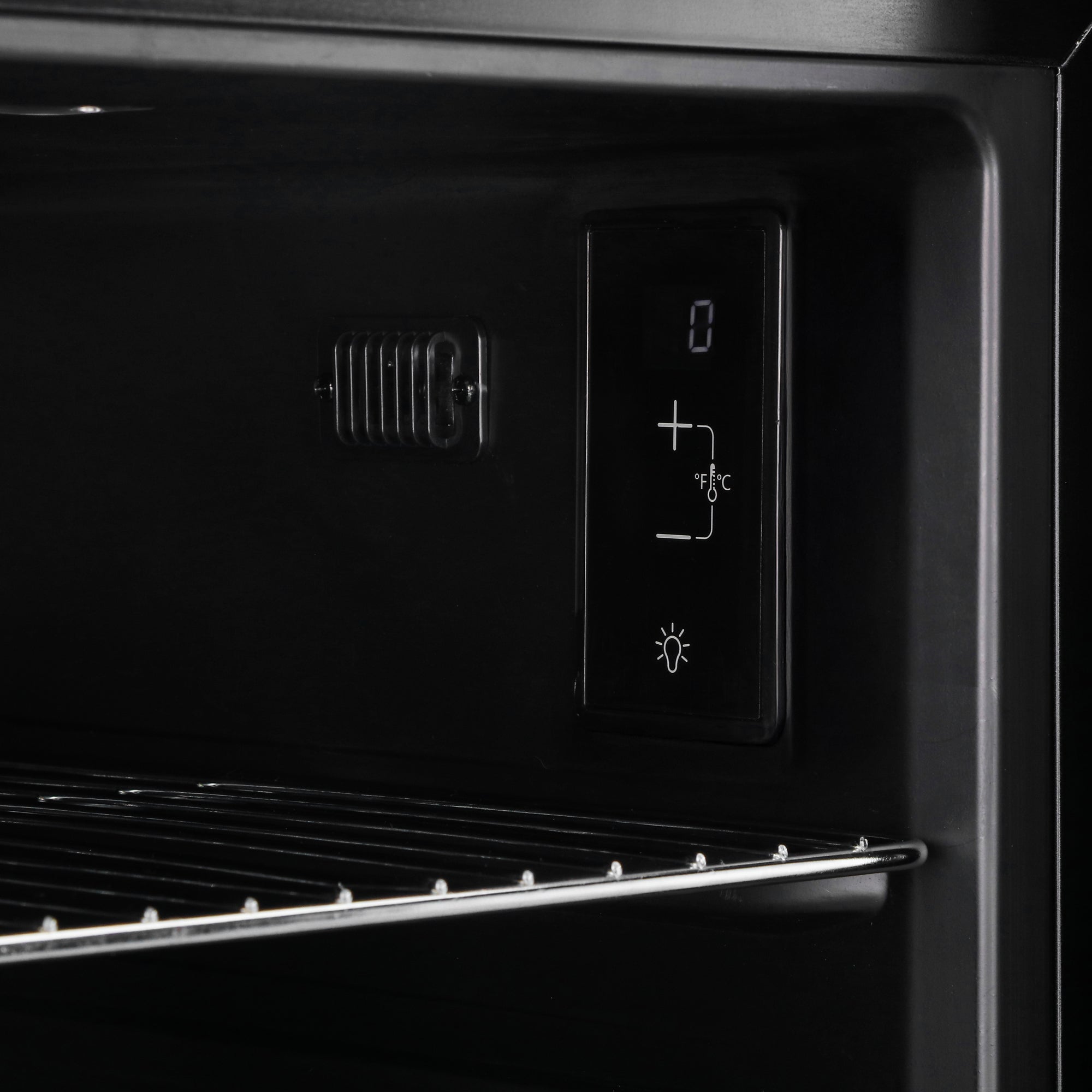 Black digital control panel with illuminated display and temperature buttons on subcold super led beer fridge