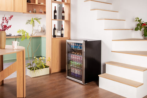 Black and stainless steel subcold super115 led beer fridge with glass door showing assorted canned drinks
