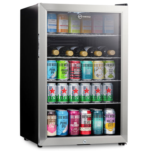 Silver-framed subcold super115 led beer fridge with glass door and black sides stocked with colorful cans and bottles