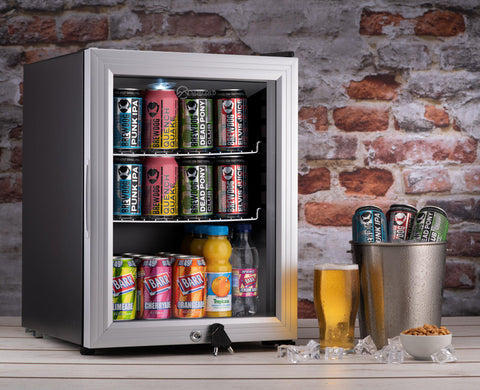 Silver-framed subcold super led beer fridge with glass door stocked with colorful beer cans and beverages