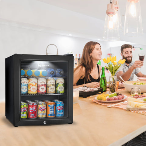 Black glass door subcold super50 drinks fridge with silver handle stocked with colorful beer cans and bottles