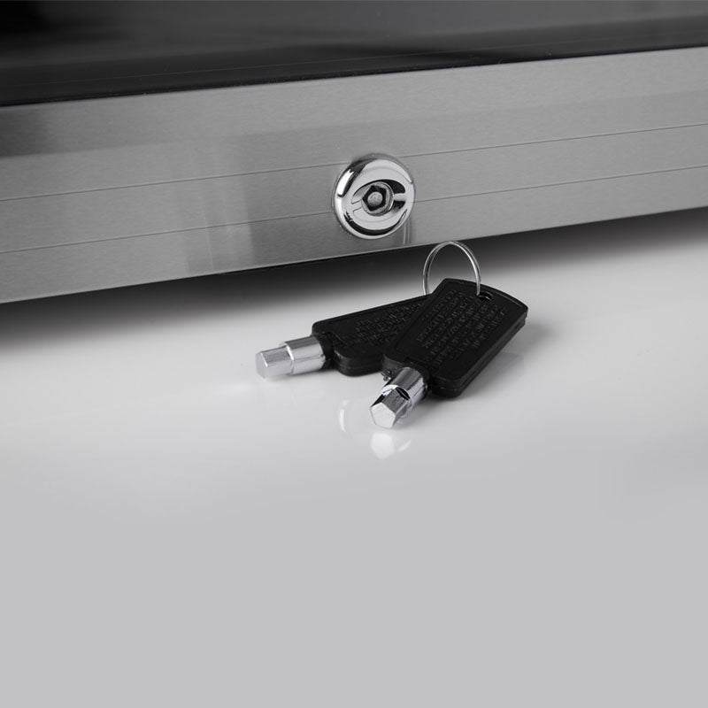 A sleek silver metal subcold super50 led beer fridge with circular keyhole and two black keys in front for secure drinks storage