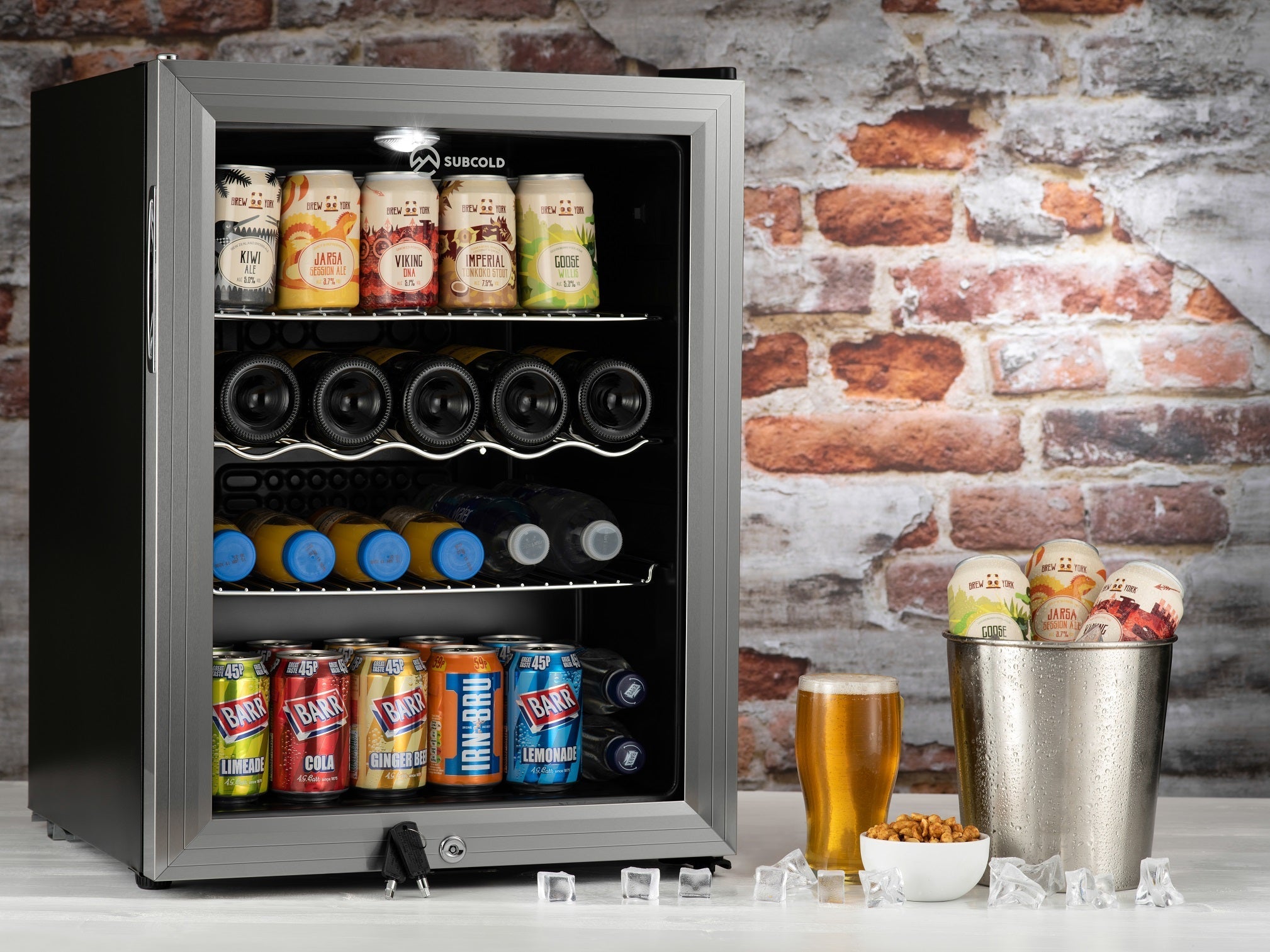Silver-framed subcold super65 drinks fridge stocked with colorful canned and bottled beverages for easy chilling