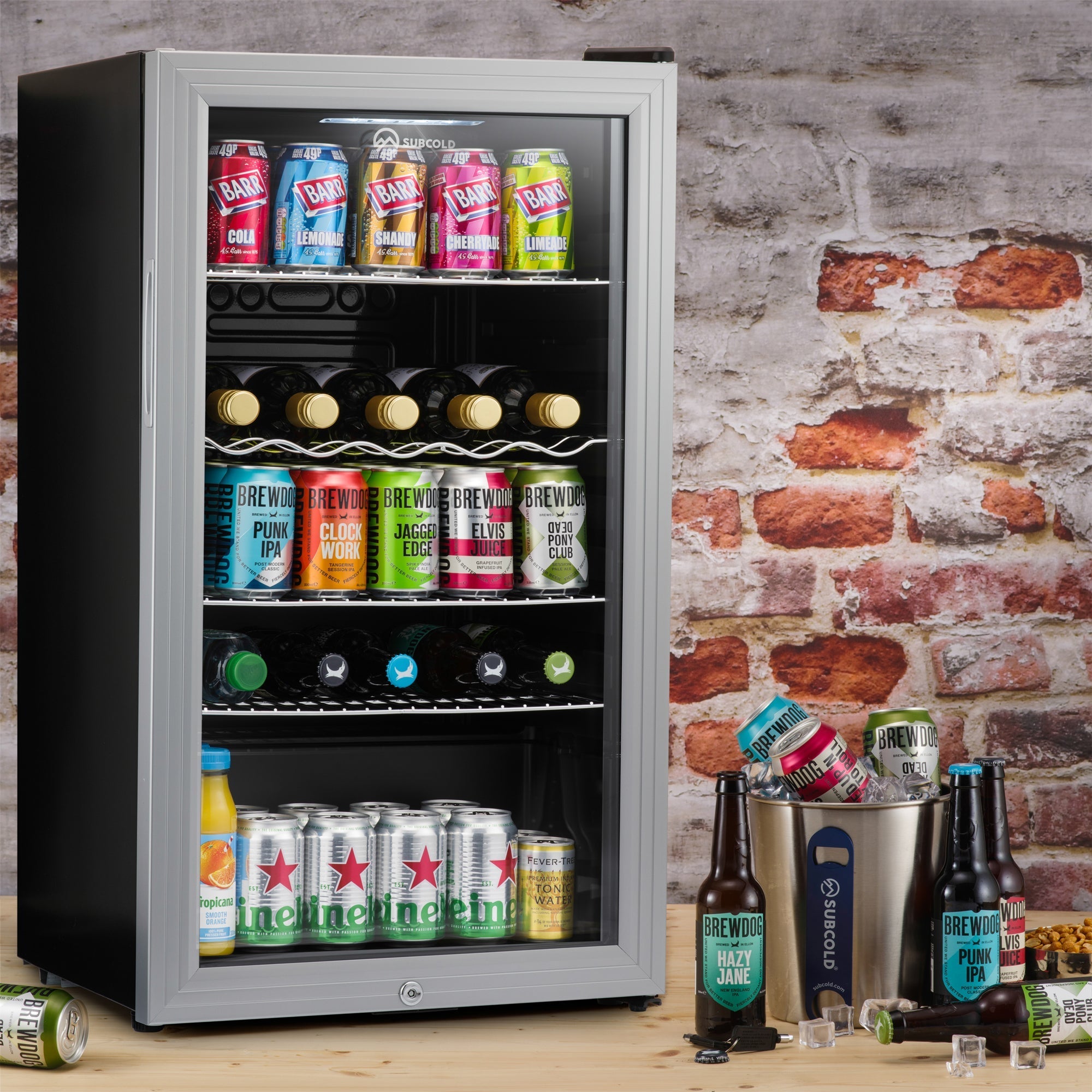 Black and silver glass-door subcold super led beer fridge with shelves stocked with assorted canned and bottled drinks