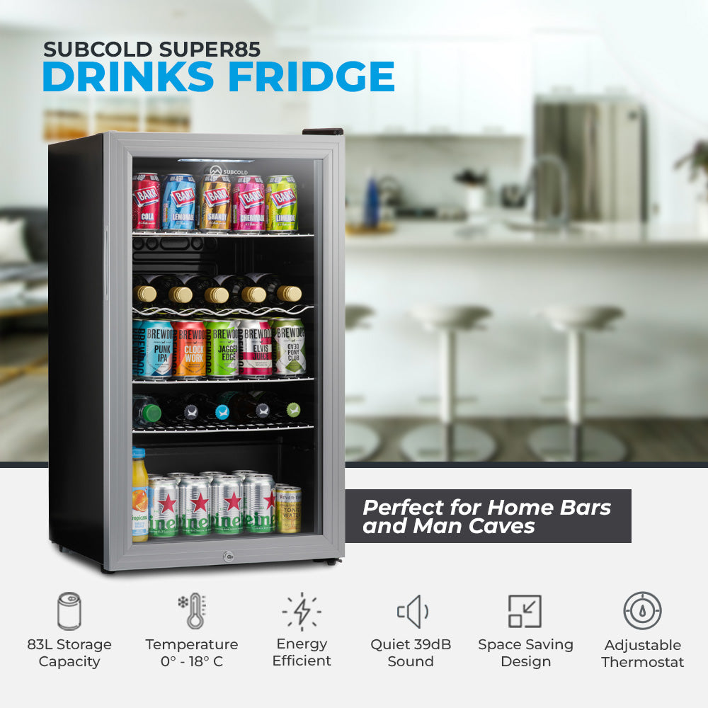 Silver finished subcold super85 led beer fridge with glass door and shelves stocked with colorful drinks
