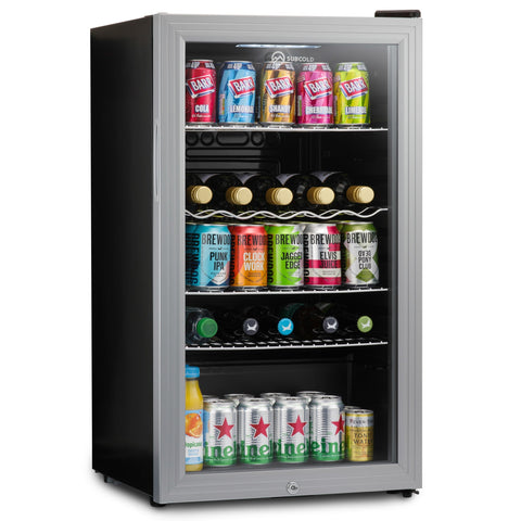 Silver-framed subcold super85 led beer fridge with black exterior and glass door stocked with colorful cans and bottles
