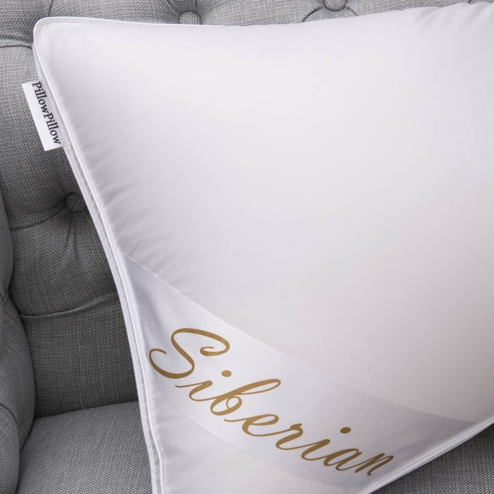 White super king pillow with gold cursive siberian lettering made from siberian goose down with a small tag