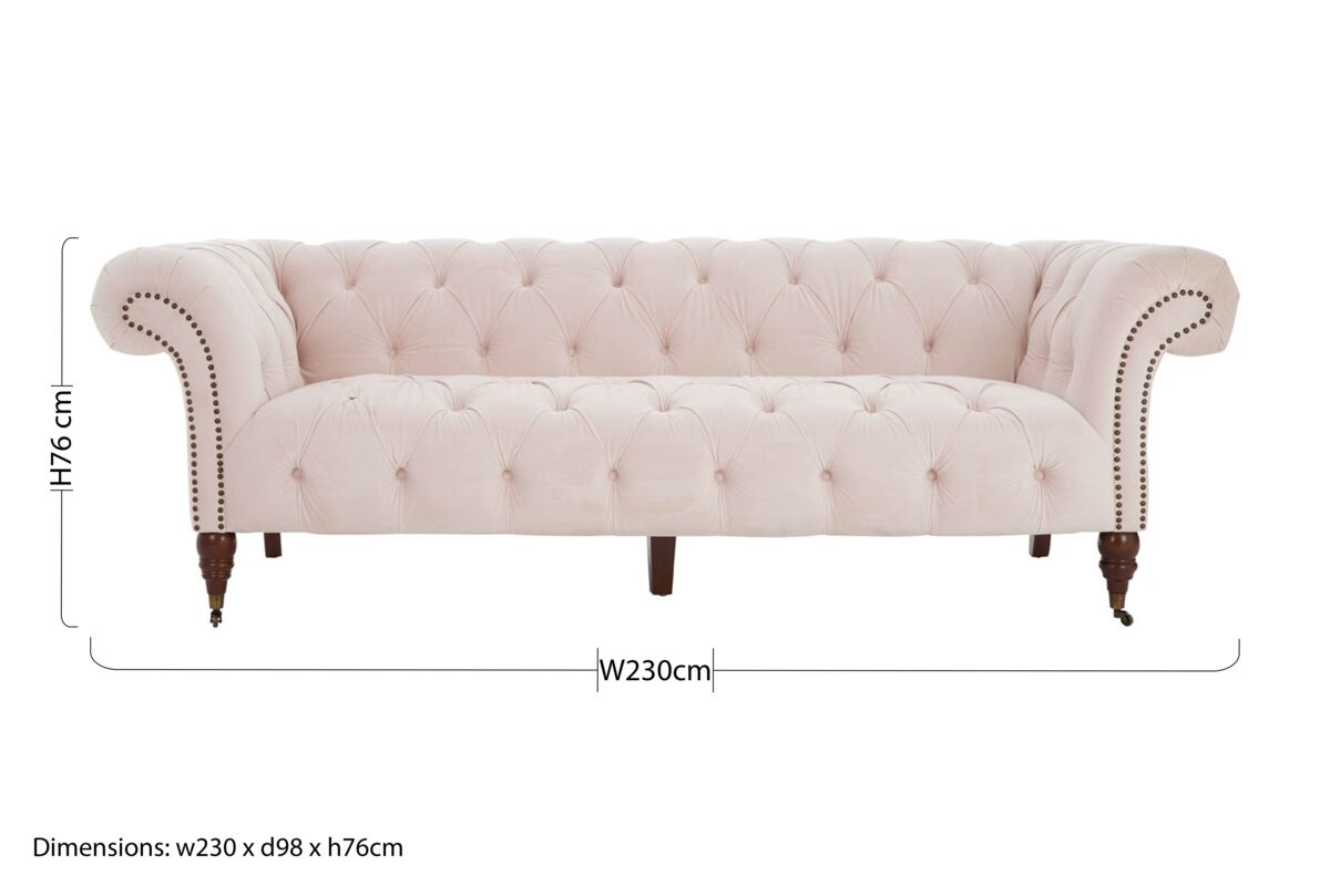 Cream-colored blossom fabric chesterfield sofa with tufted velvet, rolled arms, and dark larch wood legs