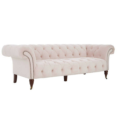Cream-colored blossom fabric chesterfield sofa with tufted velvet upholstery and larch wood legs in rolled arm design