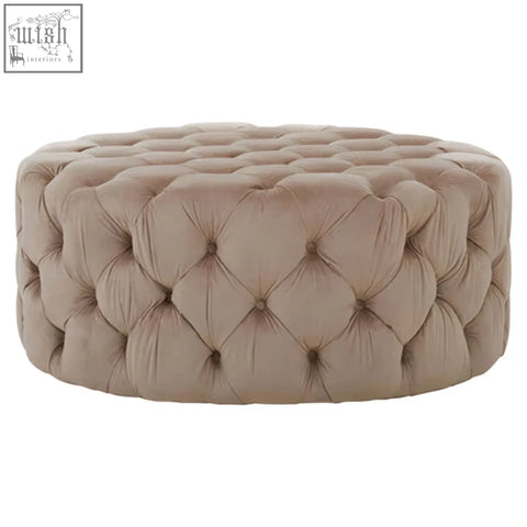 Beige tufted velvet ottoman with a round cushioned design perfect as a suri round stool or round stool option