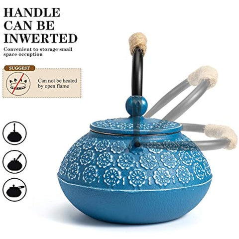 Blue cast iron iron teapot with embossed floral patterns and black handle topped with blue bead for loose leaf tea