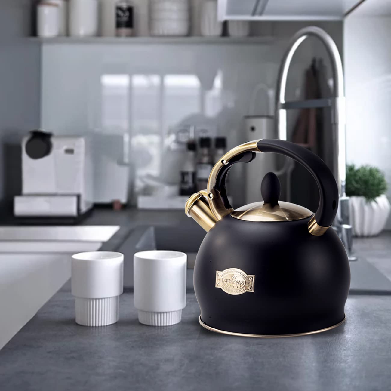Black enamel stainless steel tea kettle with gold accents and cool touch handle by susteas for stove top use