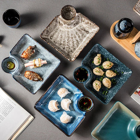 Square ceramic sutekina plates with textured glazed surfaces in muted blue and gray tones for stylish dining