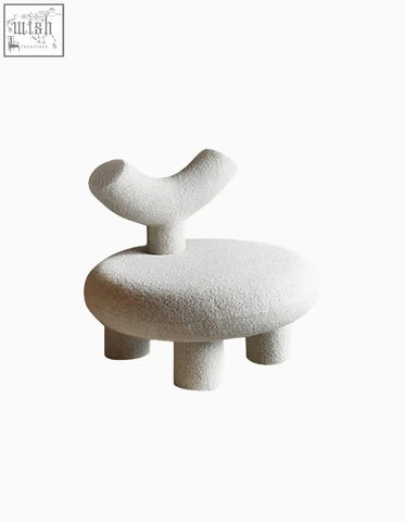 Minimalist white shapte sheep armchair with abstract antler backrest made of cashmere wool and rounded legs