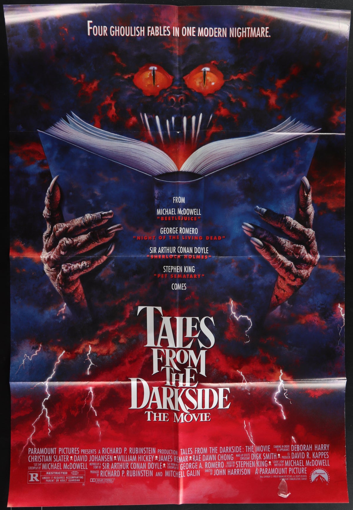 Dark ominous movie poster for tales from the darkside the movie featuring a menacing face with glowing red eyes