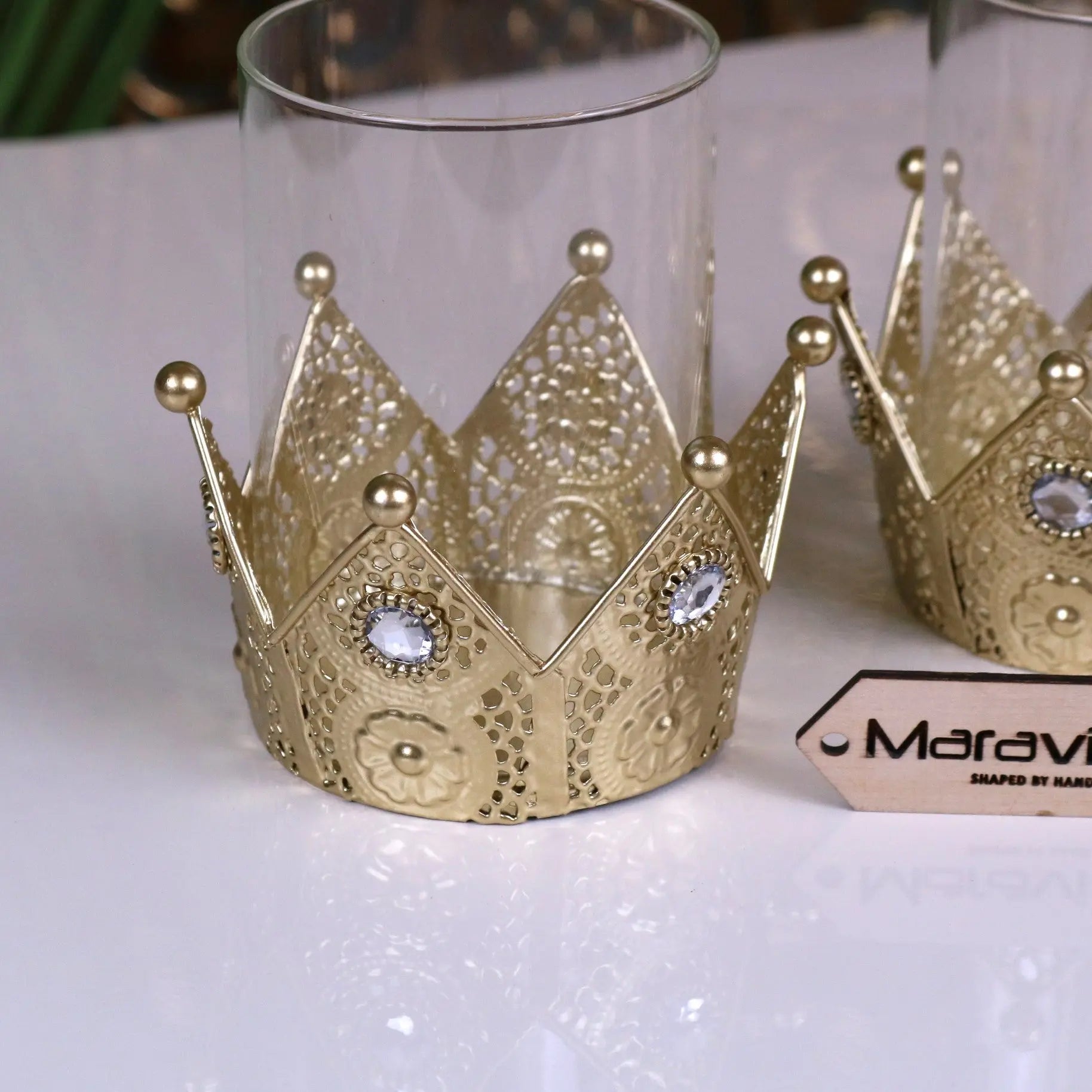 Gold-colored metal talika crown candle holder with intricate lace-like cutouts and clear gemstones set of 2