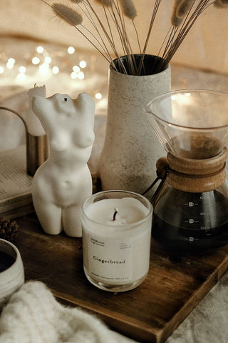 White gingerbread scented tall aphrodite body candle in clear glass jar with minimalist label and 1px solid design