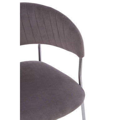 A sleek tamzin mink channel dining chair with soft gray velvet upholstery and slender mink channel chrome legs